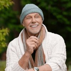 Aaravindha Himadra sitting in green garden