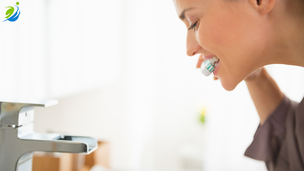Restaurant safety professional brushing her teeth while reflecting on the insight that safety success comes from consistency, accountability, reinforcement, and systems—not training videos alone.