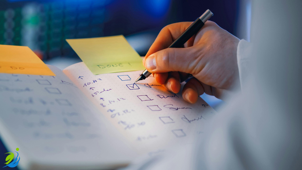 Close-up of a person checking off items on a checklist in a notebook, representing the importance of documenting safety procedures and training in a restaurant environment.
