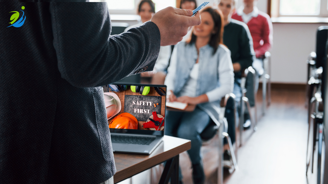 Restaurant safety training session with employees attending a classroom-style workshop while an instructor presents safety procedures and workplace injury prevention techniques.
