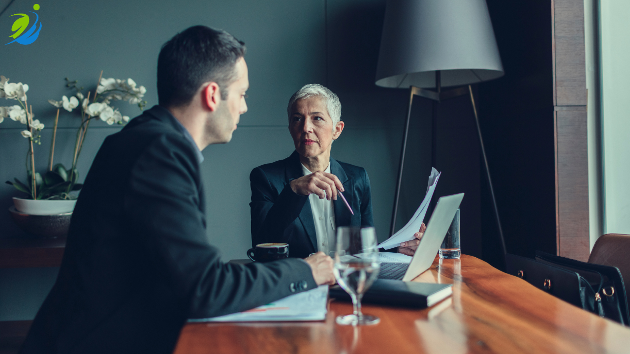 Restaurant executives reviewing workers' compensation claims and workplace safety documentation during an important business meeting.