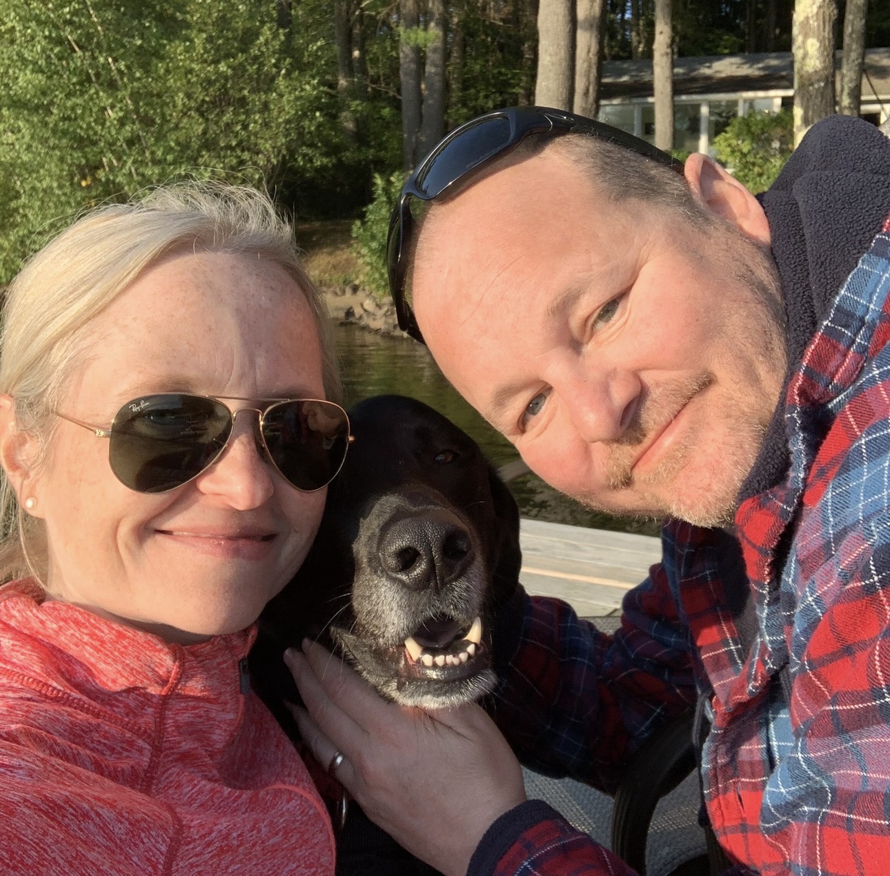 Michelle A. Bourque with her husband, Marc, and their rescue dog, Tucker