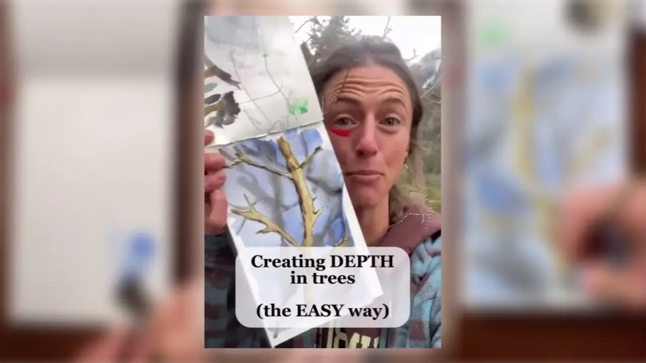 Artist Juliene holds a watercolor painting of trees, demonstrating an easy technique for creating depth in watercolor trees.