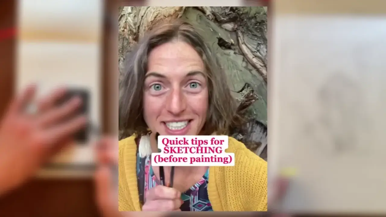 Artist Juliene holding paintbrushes outdoors, sharing simple sketching tips before watercolor painting to create stronger compositions and more confident watercolor artwork.