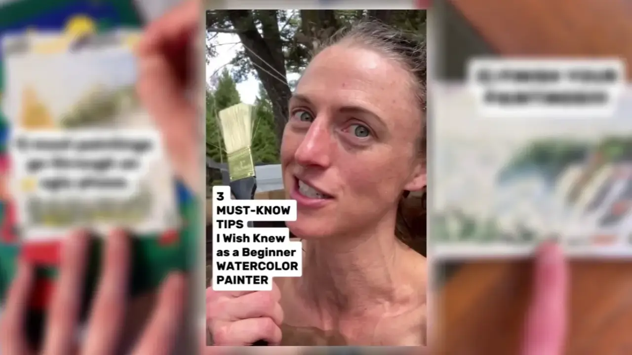 Artist Juliene holding a watercolor brush outdoors, sharing three mindset tips to help beginner watercolor artists build confidence, improve skills, and enjoy the painting process.