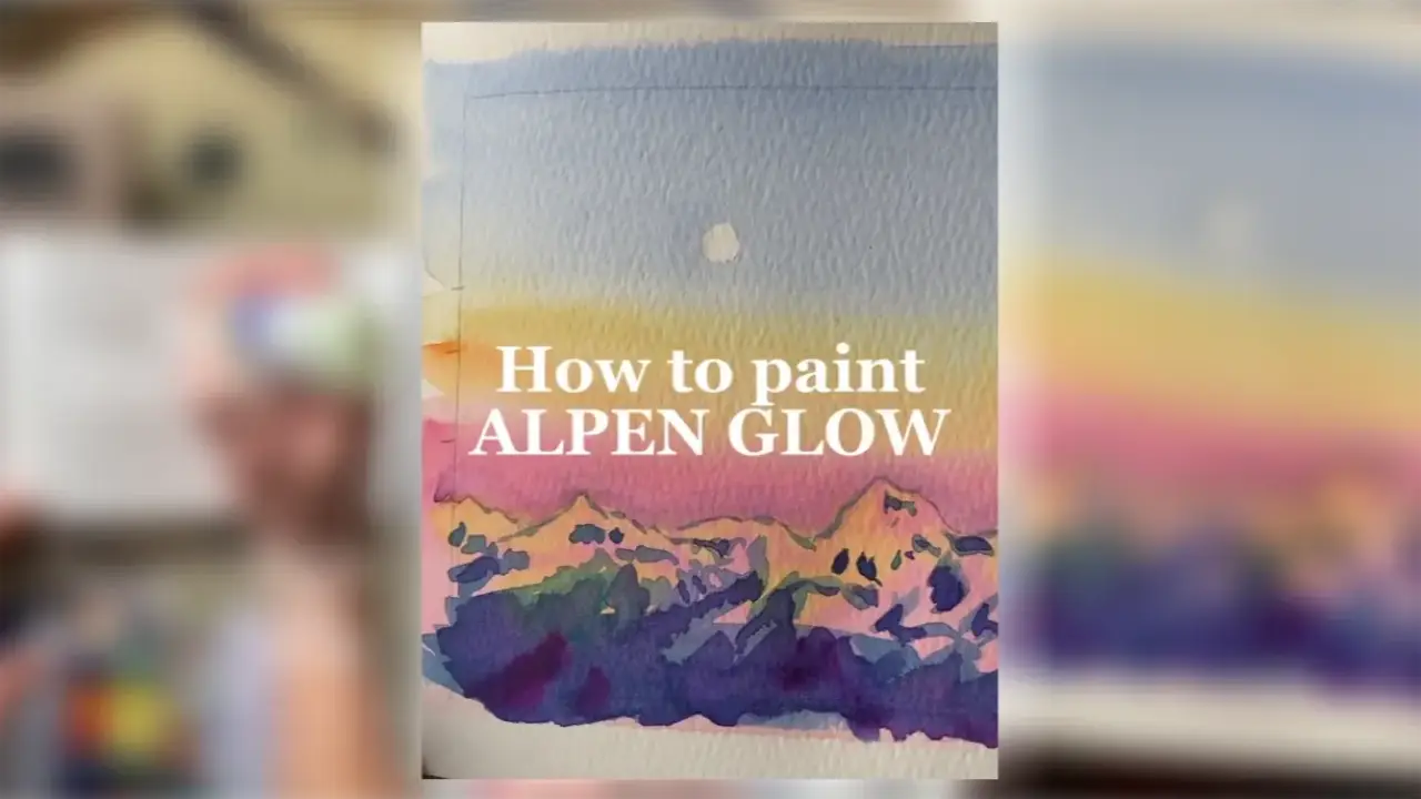 Watercolor painting of mountain peaks glowing pink and orange beneath a blue sky, demonstrating how to paint alpenglow and create light through color, by artist Juliene.