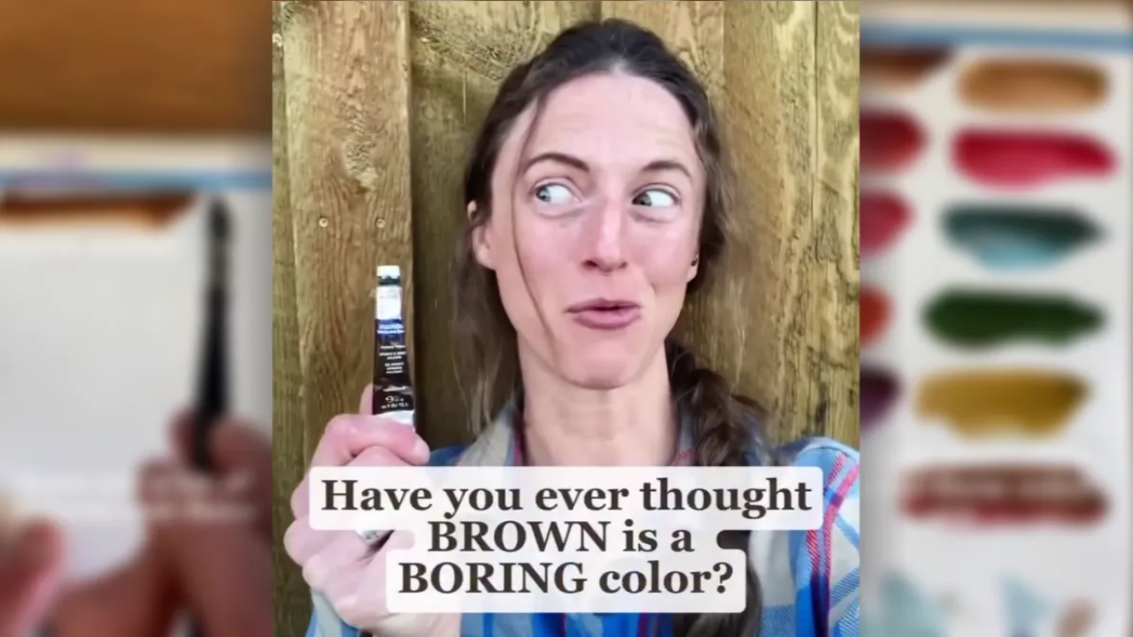 Artist Juliene holding a watercolor paint tube beside brown color swatches, exploring how to mix brown watercolor and create rich, varied earthy tones.