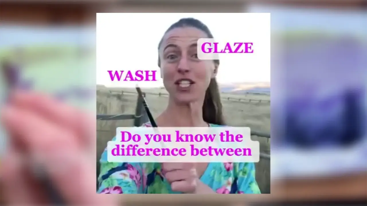 Juliene holds a watercolor brush outdoors with “Wash” and “Glaze” labels, illustrating the difference between watercolor glaze and wash techniques.