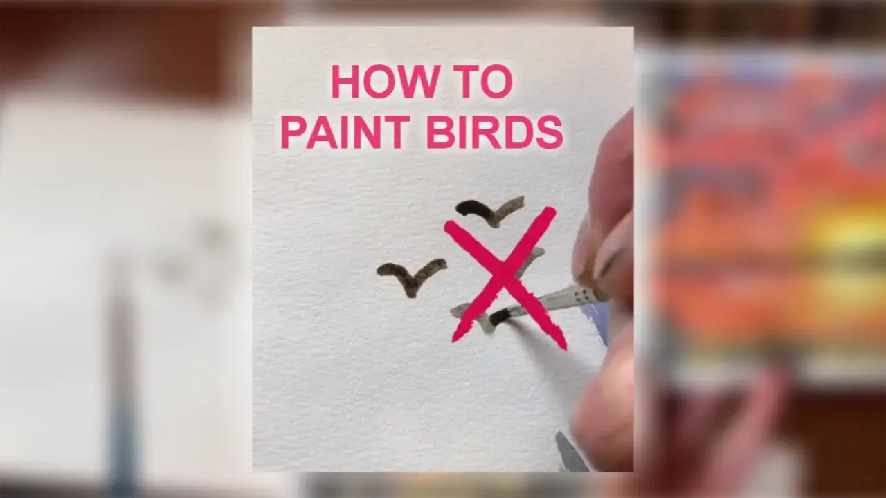 Arist Juliene paints simple V-shaped birds on watercolor paper, one crossed out in pink, showing how to paint birds in watercolor.