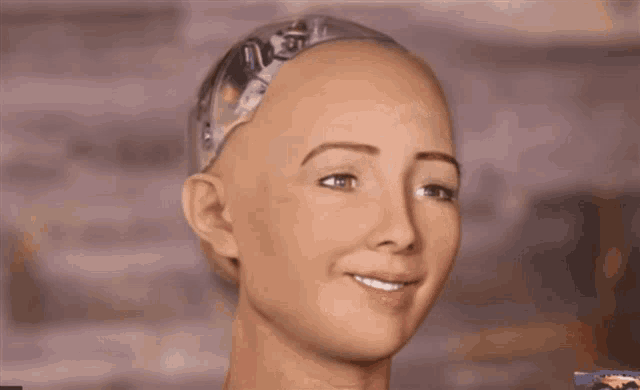 A humanoid robot with exposed mechanical components on its head gives a slow, unsettling smile. The smile gradually widens in a stiff and slightly uncanny manner, creating a sense of awkwardness or discomfort.