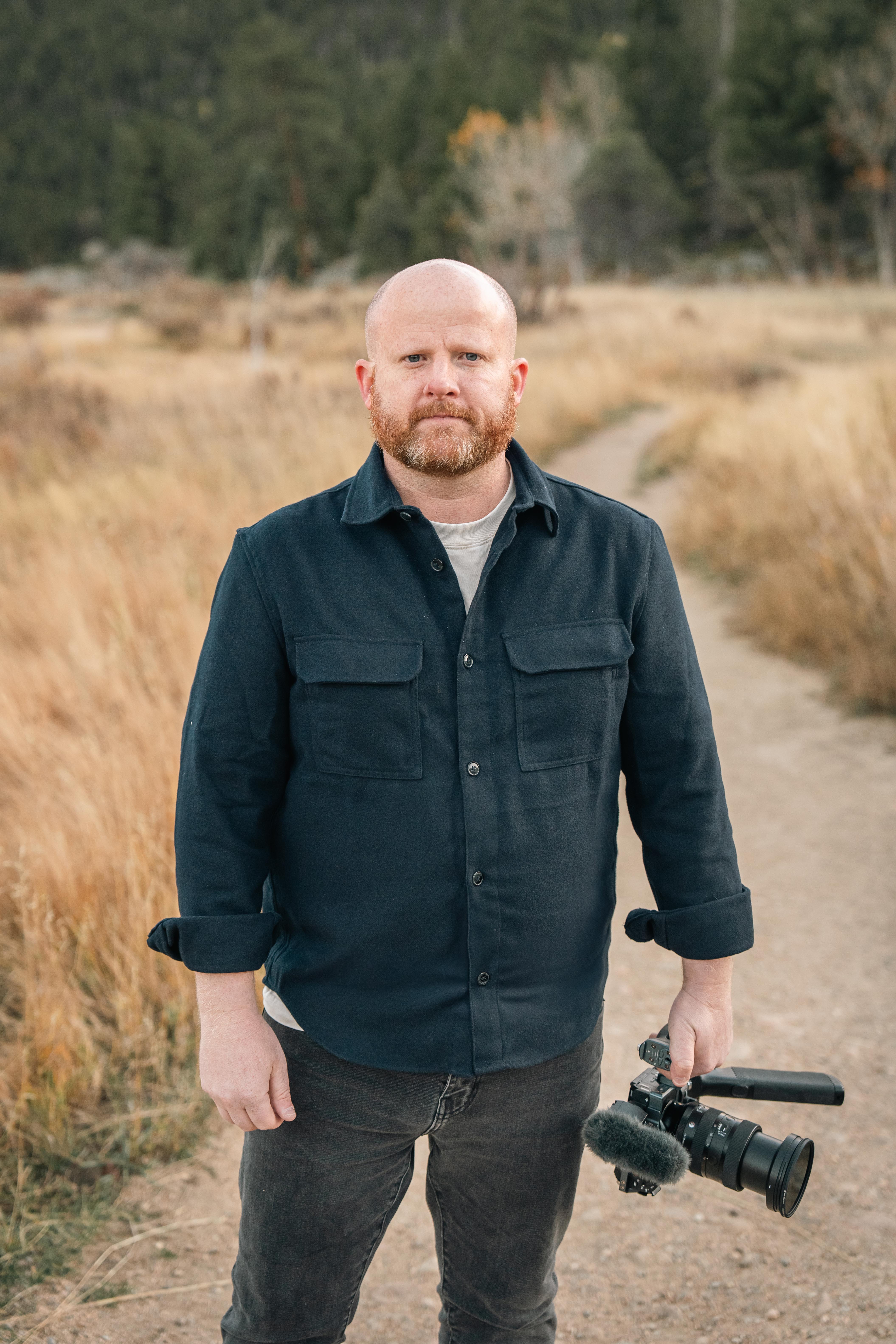Patrick Murphy holding a camera