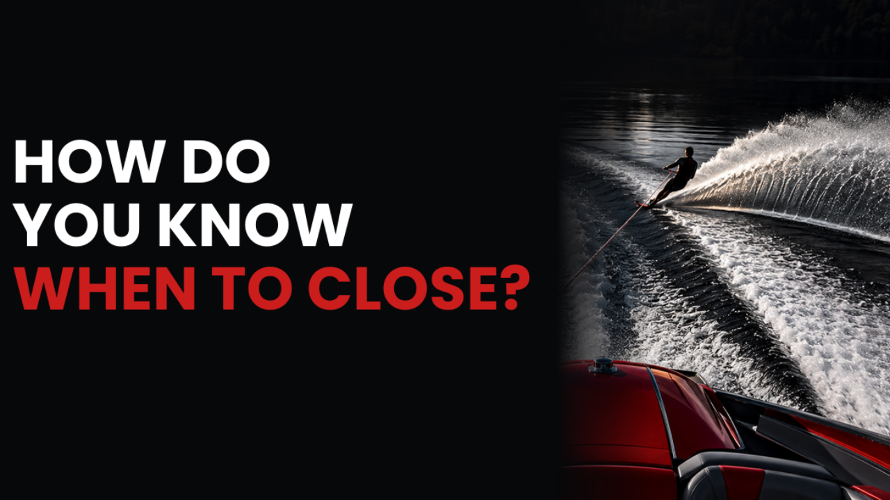 Water skier crossing the wake behind a red speedboat, illustrating the moment to close a sale