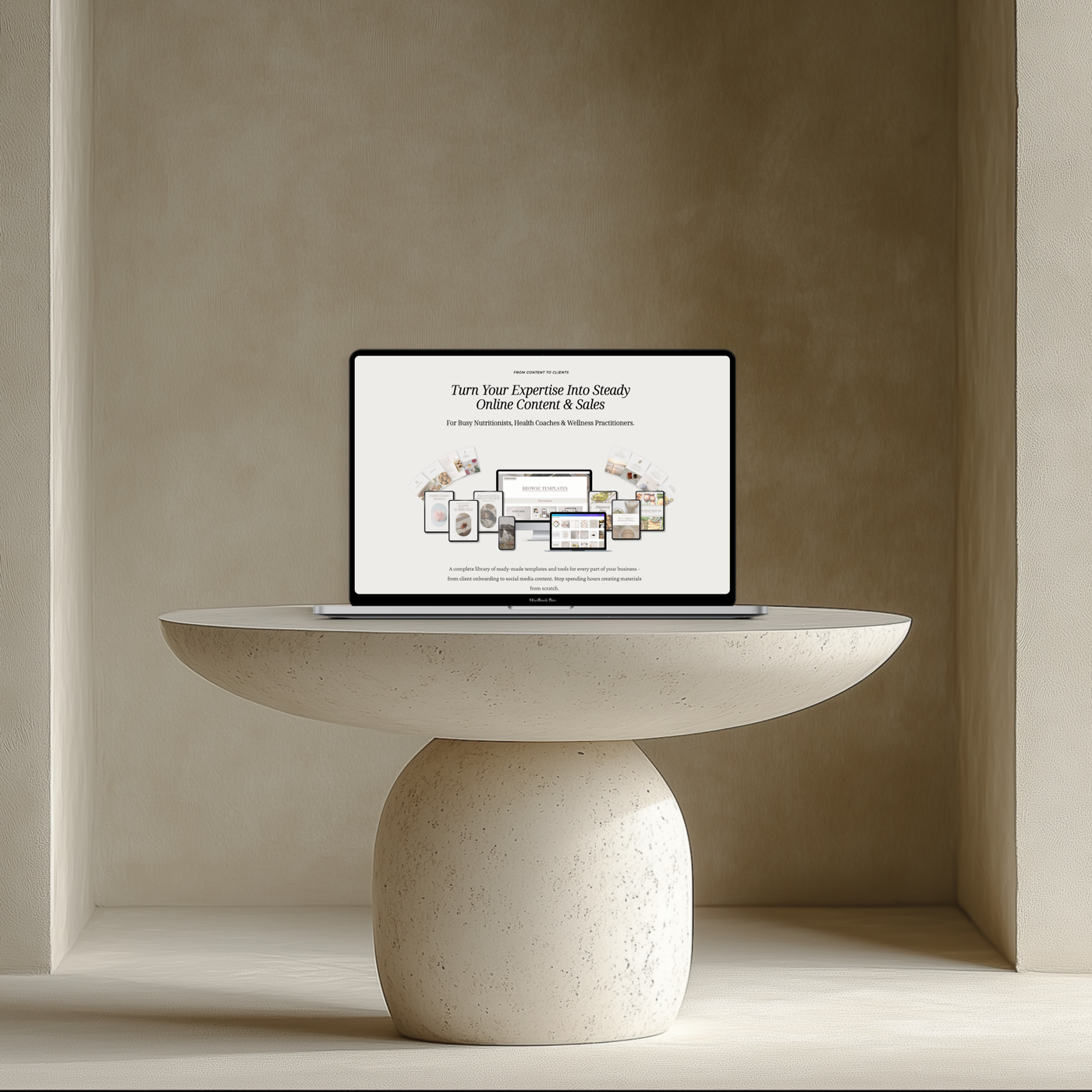 Laptop on a stone pedestal table showing the Thrive template studio