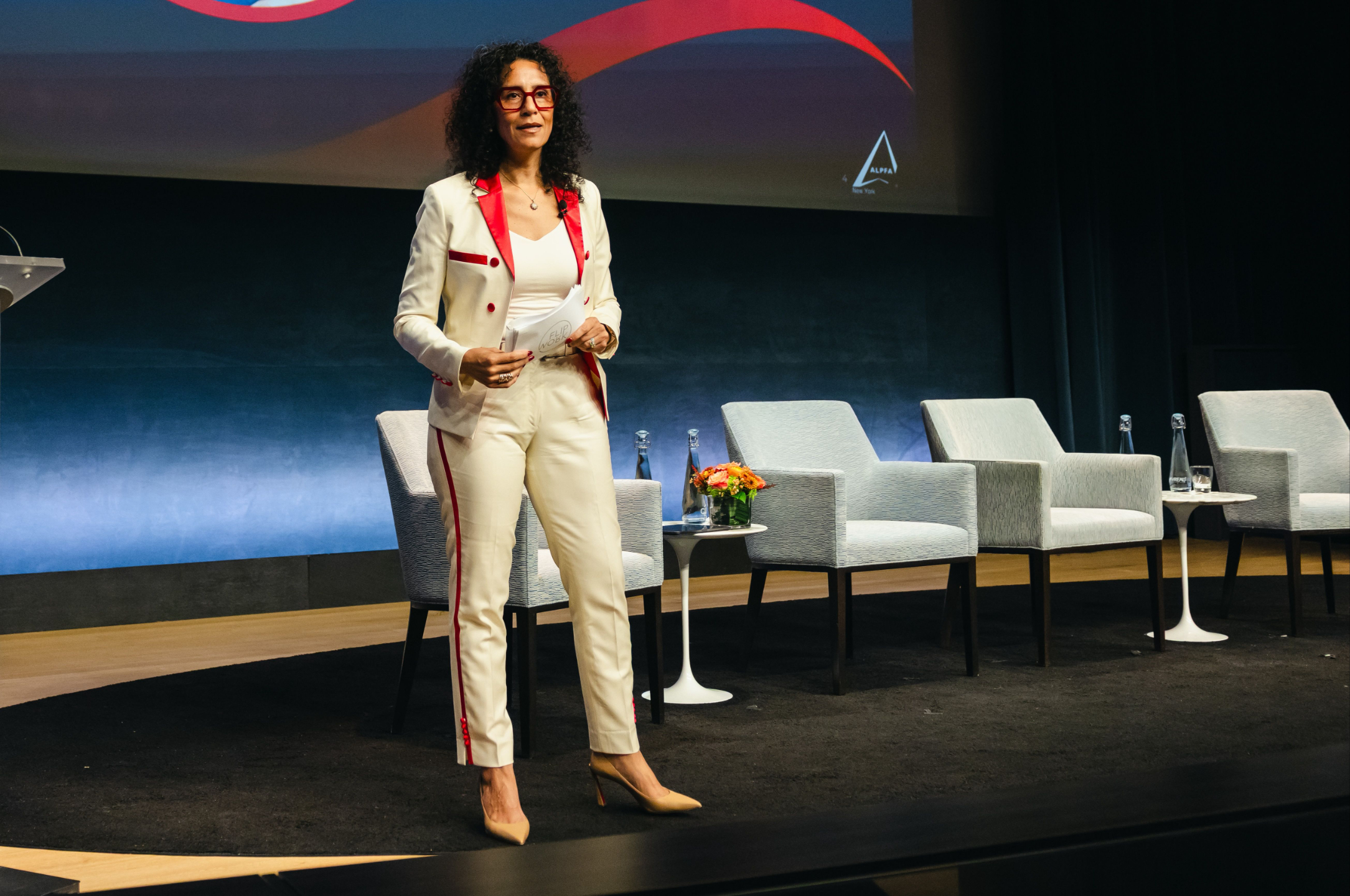 Monica speaking at an event