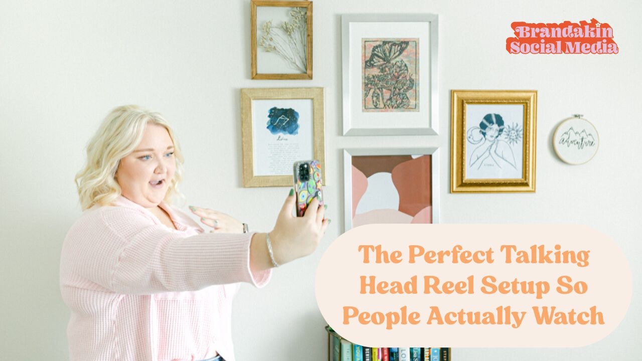 Woman filming a talking head video on her phone in front of a styled wall with framed art. Text reads “The Perfect Talking Head Reel Setup So People Actually Watch.”