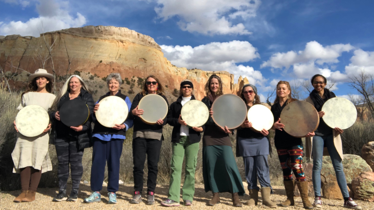 Krista Holland and a group of drummers holding their frame drums at Ghost Ranch, New Mexico