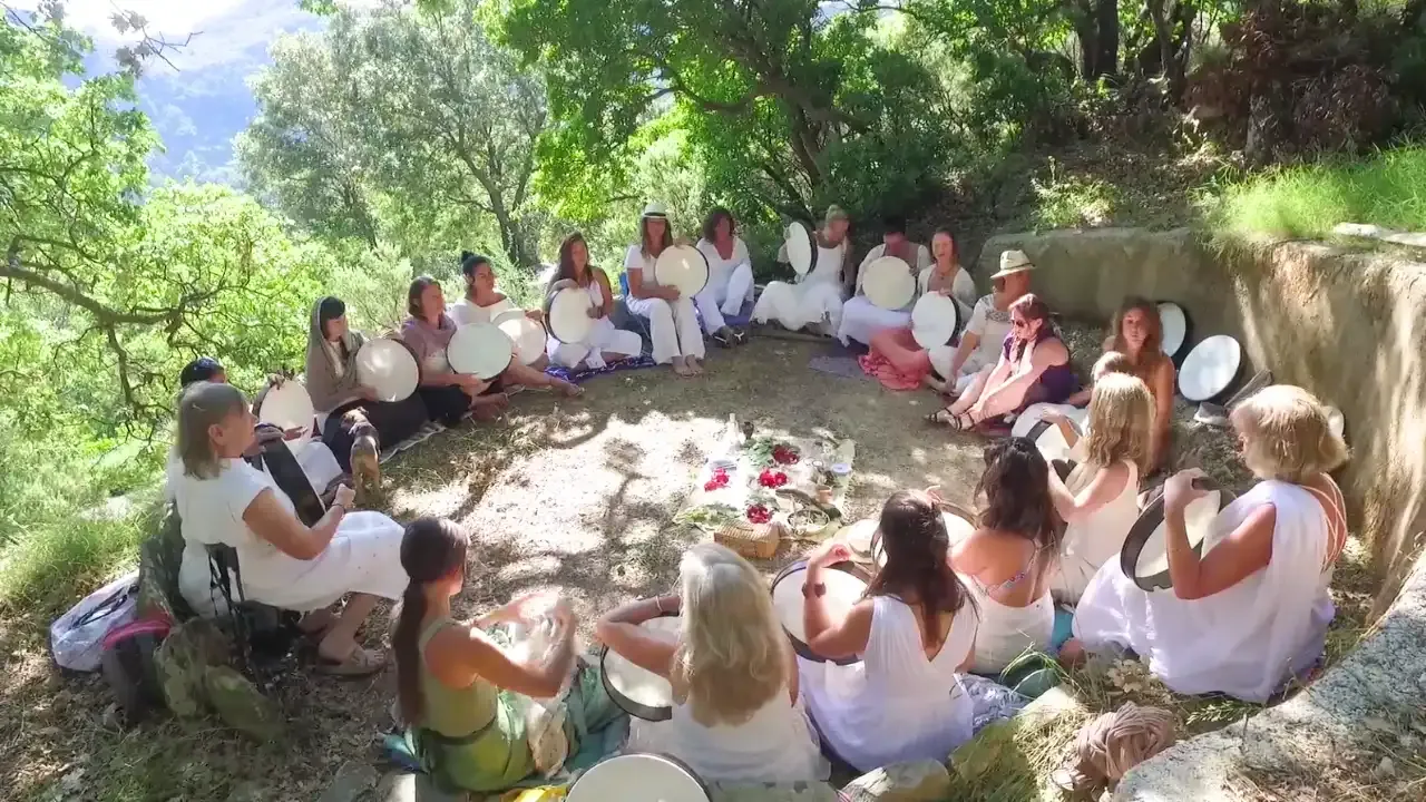Krista Holland and a circle of frame drummers with their frame drums on retreat in Crete, Greece width="1280" height="720"px