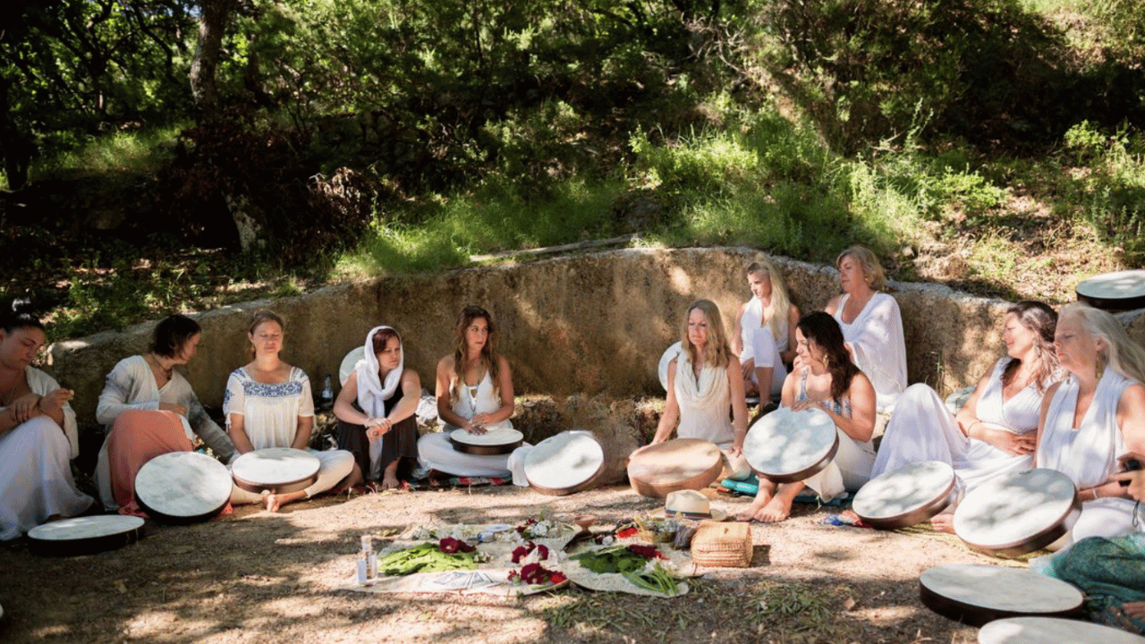 Krista Holland leading a frame drumming circle with a group of women in Crete, Greece