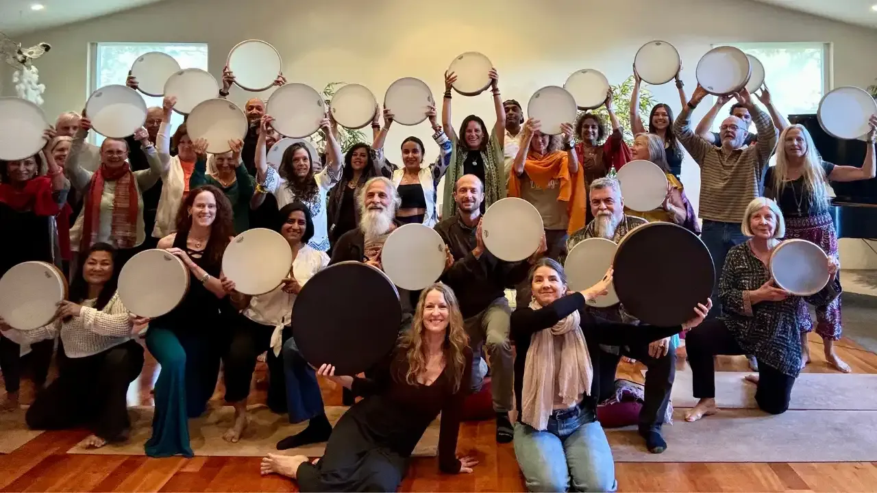krista holland and a group of 30 frame drummers holding frame drums at a retreat in Sedona, Arizona