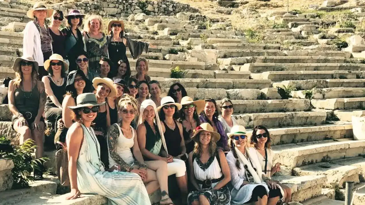 Krista Holland and 27 women on retreat in Athens, Greece sitting on the steps of an ancient amptheater in Athens, Greece width="1280" height="720"px