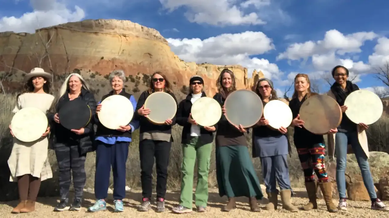 Krista Holland and a group of drummers holding their frame drums at Ghost Ranch, New Mexico