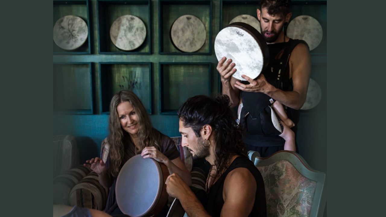 Krista Holland with two male frame drummers playing frame drums