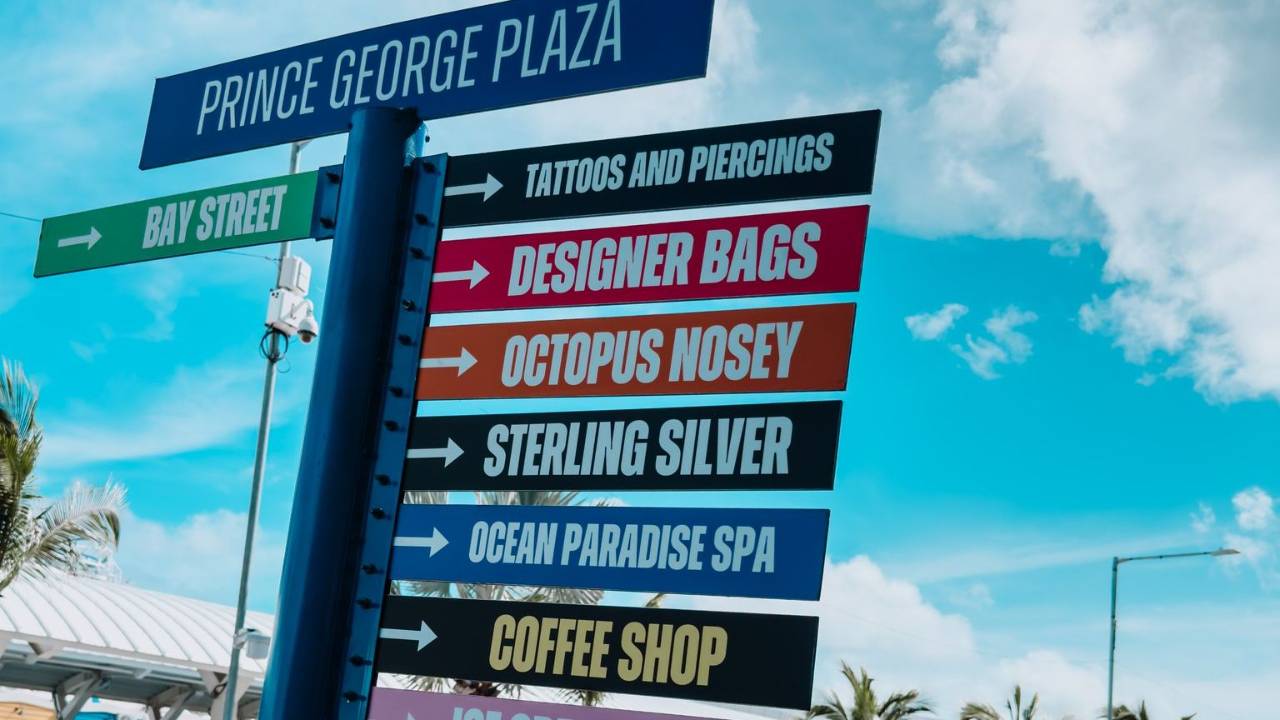 Avoid cruise port money scams, sign pointing out fake luxury bags