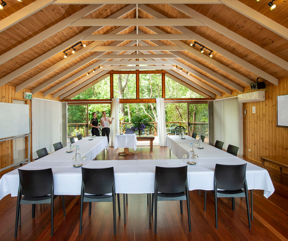 The training hall at Kondalilla, timber beams opening onto rainforest