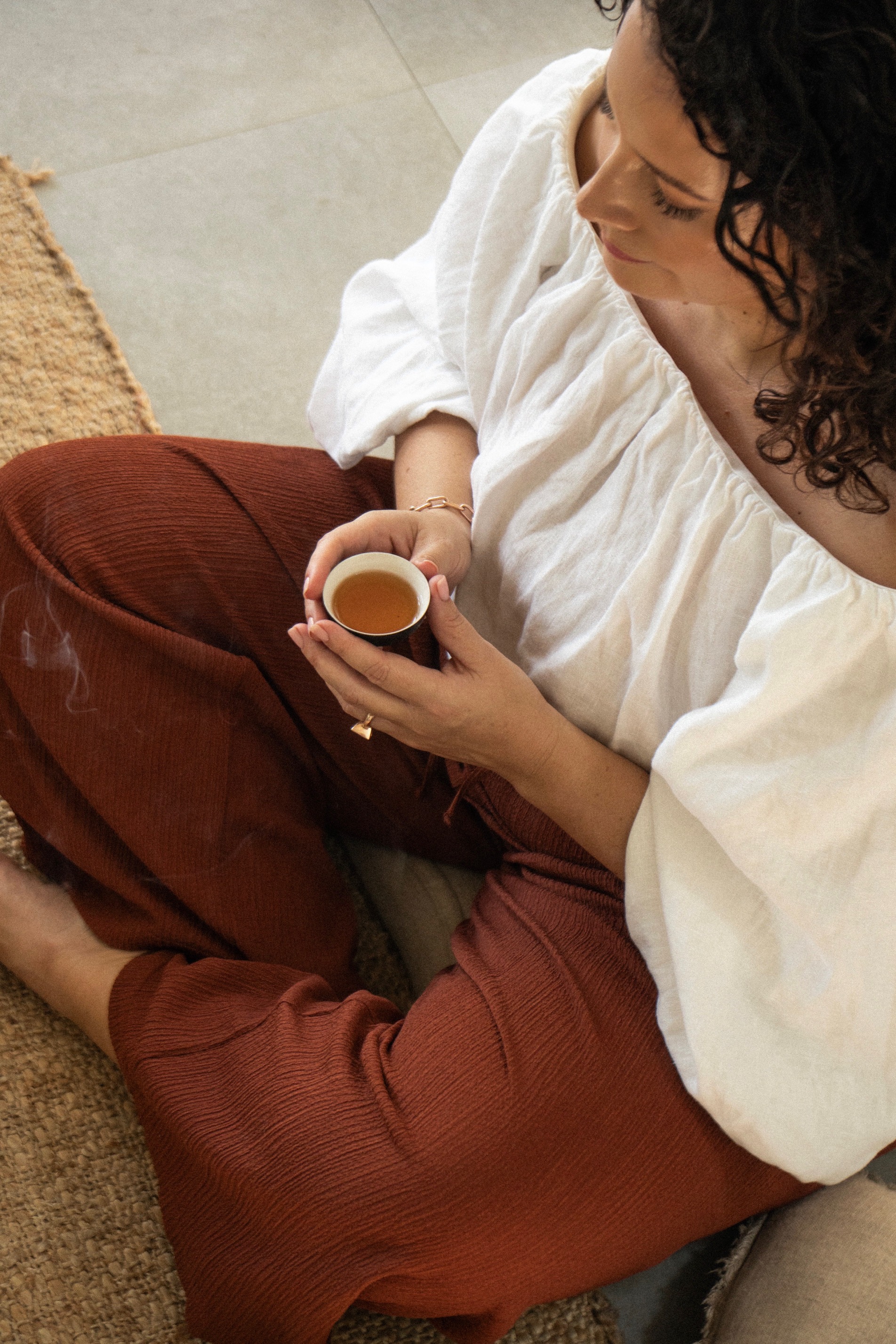 Tara holding a cup of tea