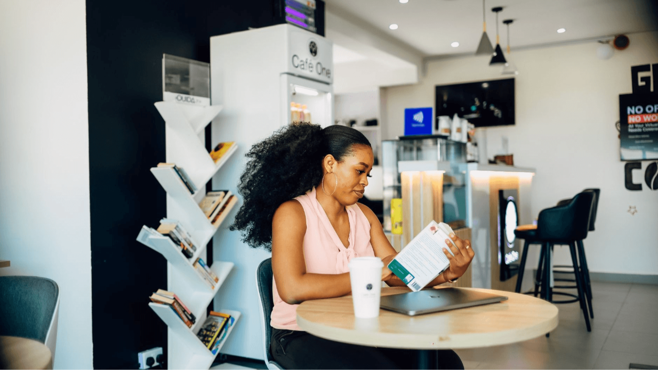 image of a woman working in a coffee shop