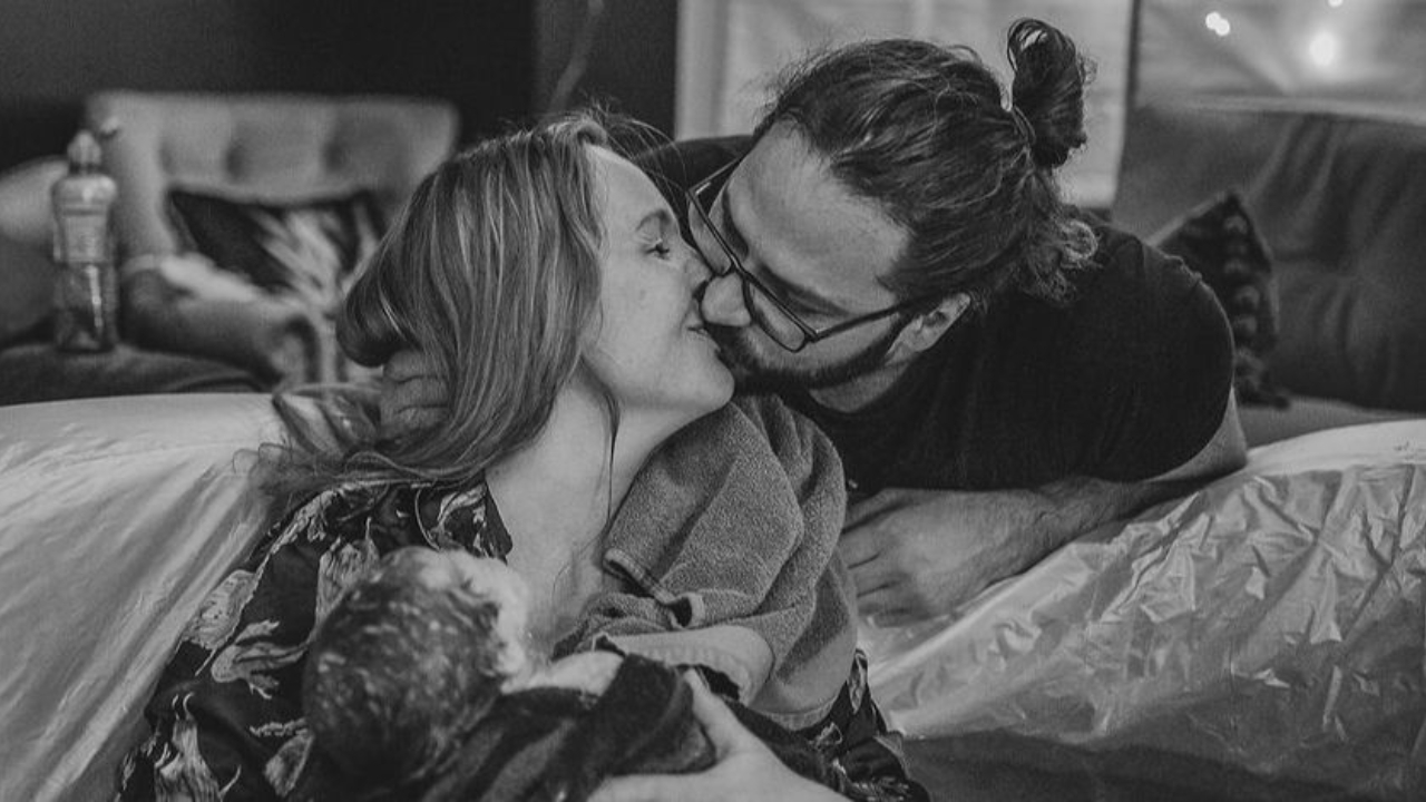 Birth partner supporting a pregnant woman during labour after attending hypnobirthing classes