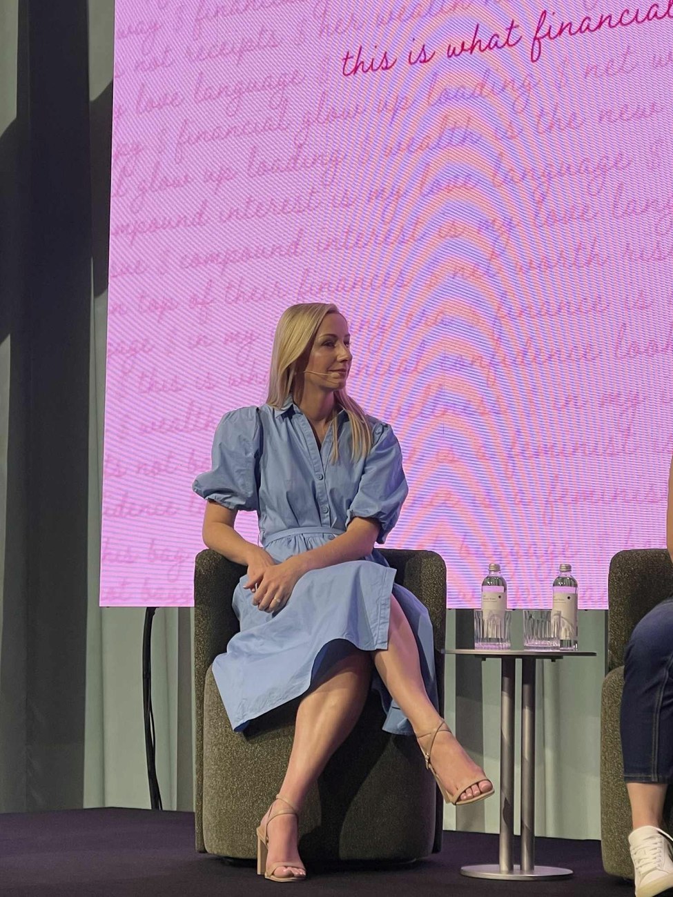 Ashleigh Conwell on stage at a conference