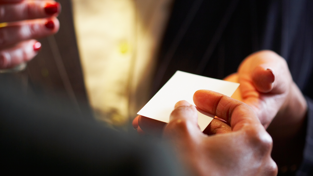 Introverted professional in a quiet one-on-one networking conversation