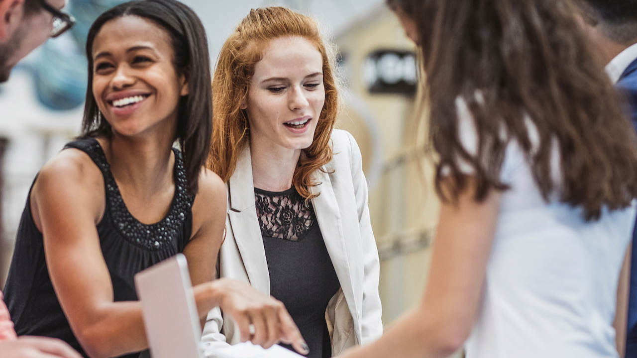 Professional writing a thoughtful follow-up message after a networking event