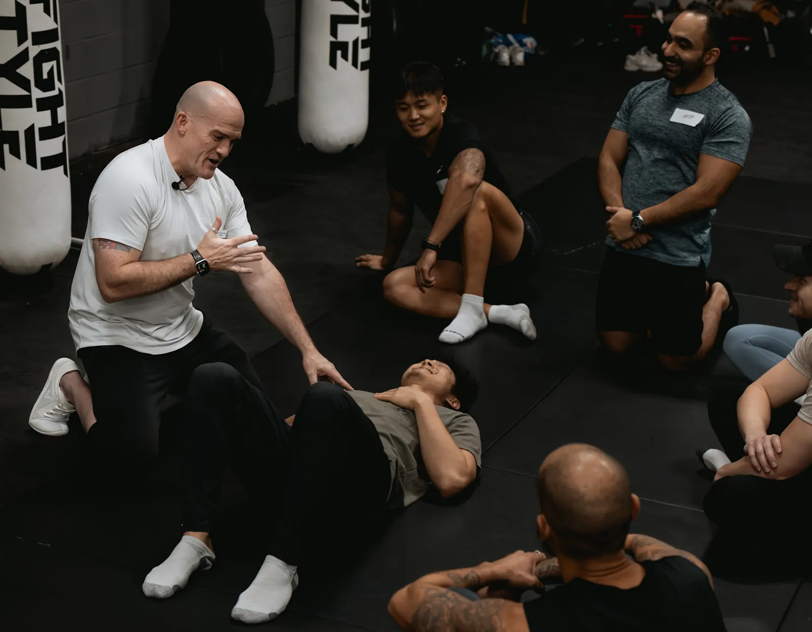 Ben guiding a participant through a floor movement