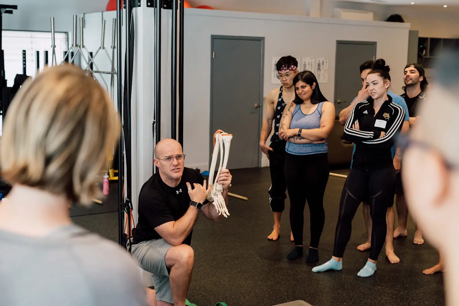 Ben McDonald explaining movement and anatomy to attentive participants