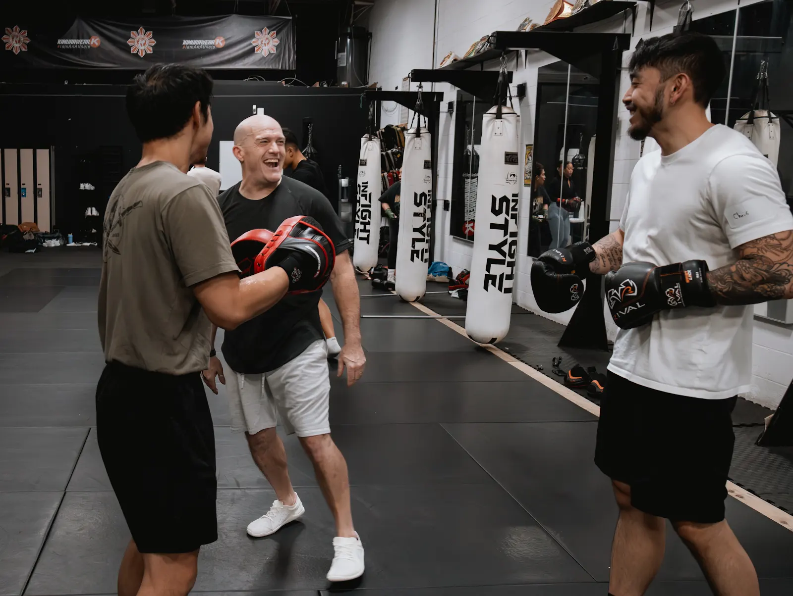 Ben McDonald smiling with training participants in the studio