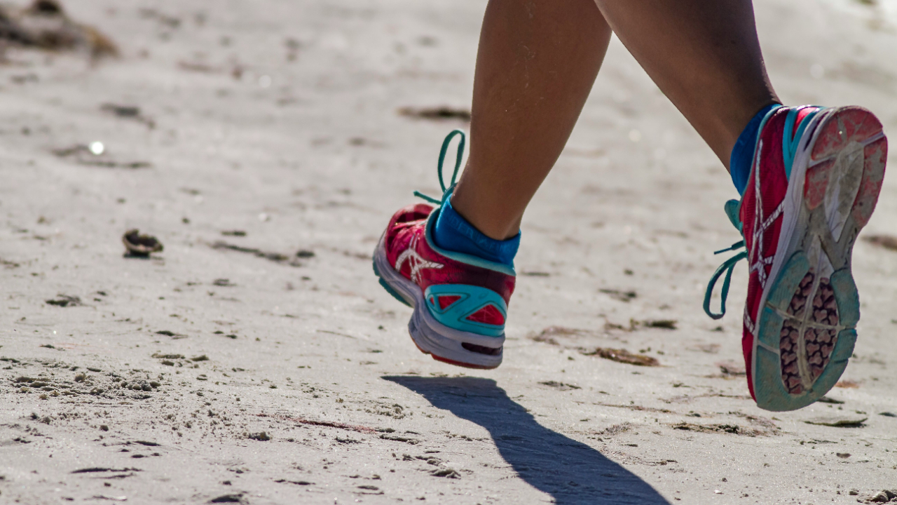 image of shoes running on the road to symbolize the run-walk intervals that a runner can take to complete a marathon