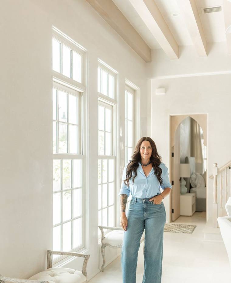 Lindsey standing in a bright room