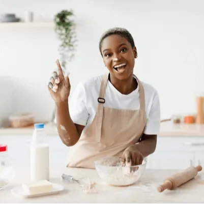 baker kneading dough with a smile