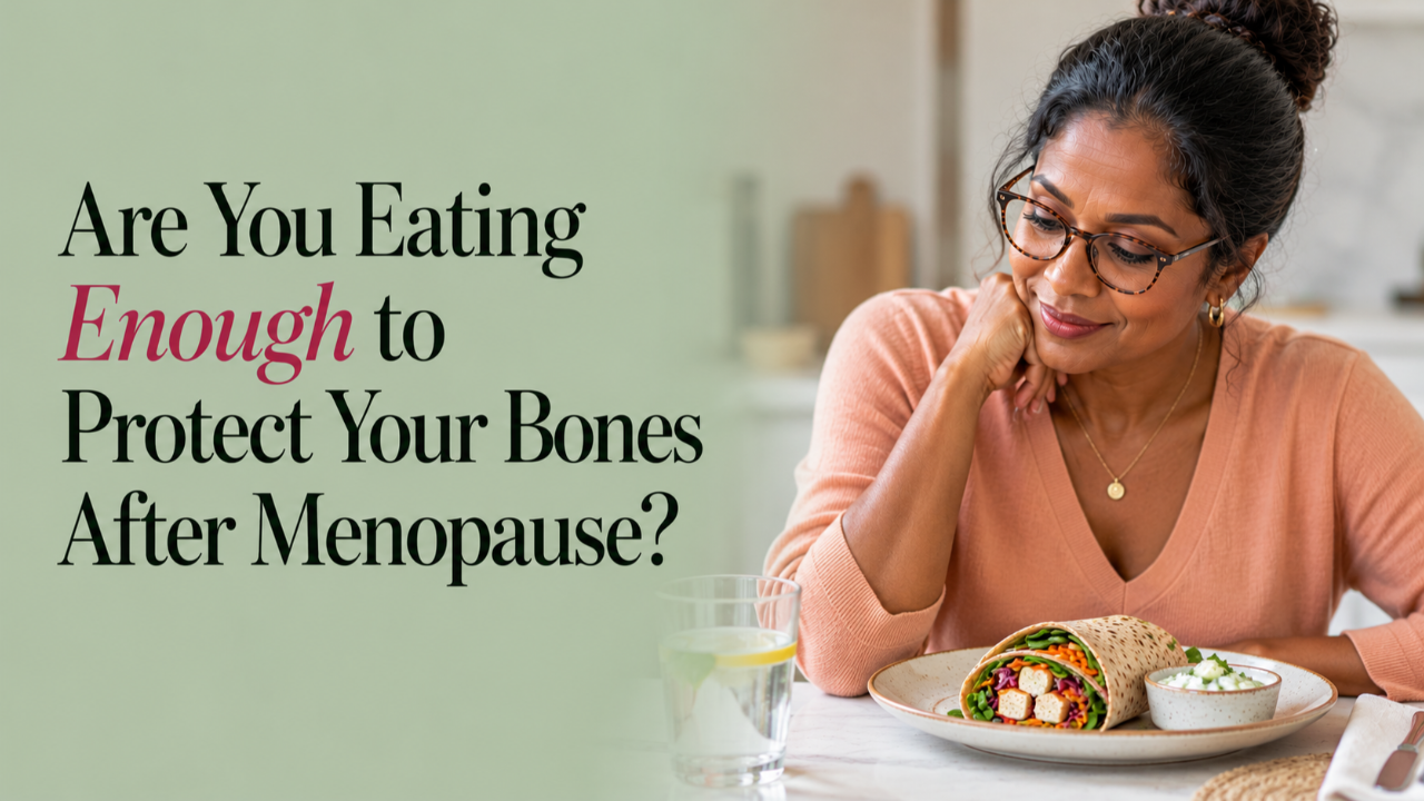 Sri Lankan woman in her 50s with dark hair in a bun and glasses, enjoying a wholegrain tofu and vegetable wrap with cucumber yoghurt, illustrating nutritious eating for bone health after menopause.