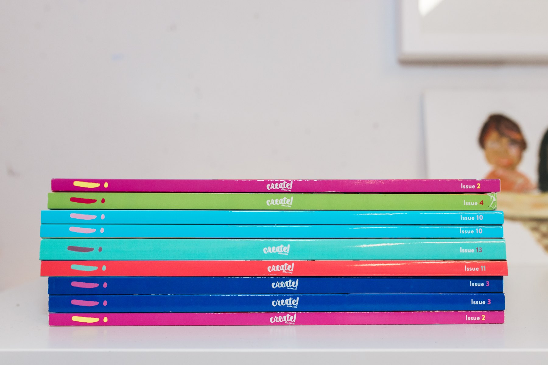 A stack of Create! Magazine issues