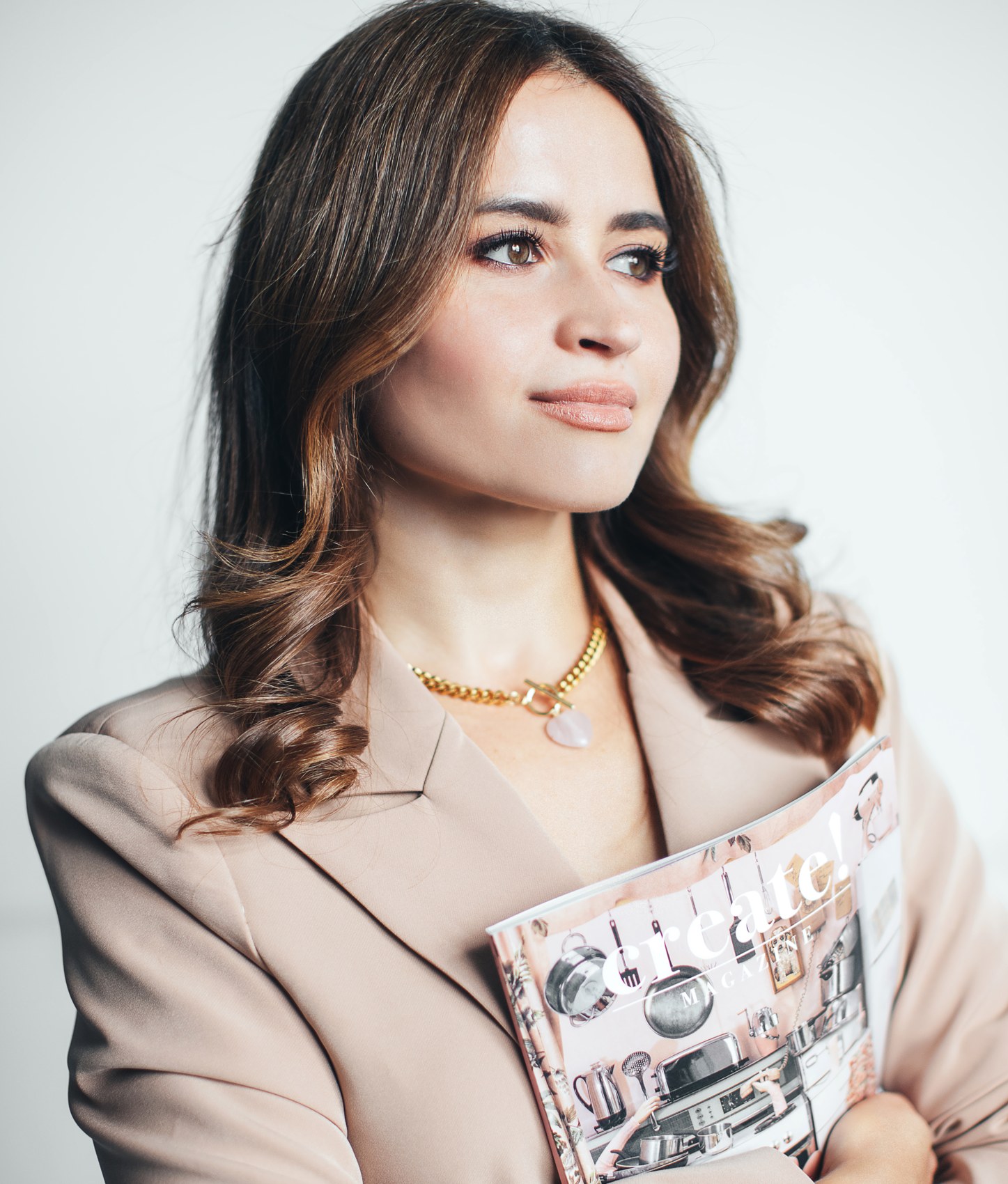 Ekaterina Popova holding Create! Magazine