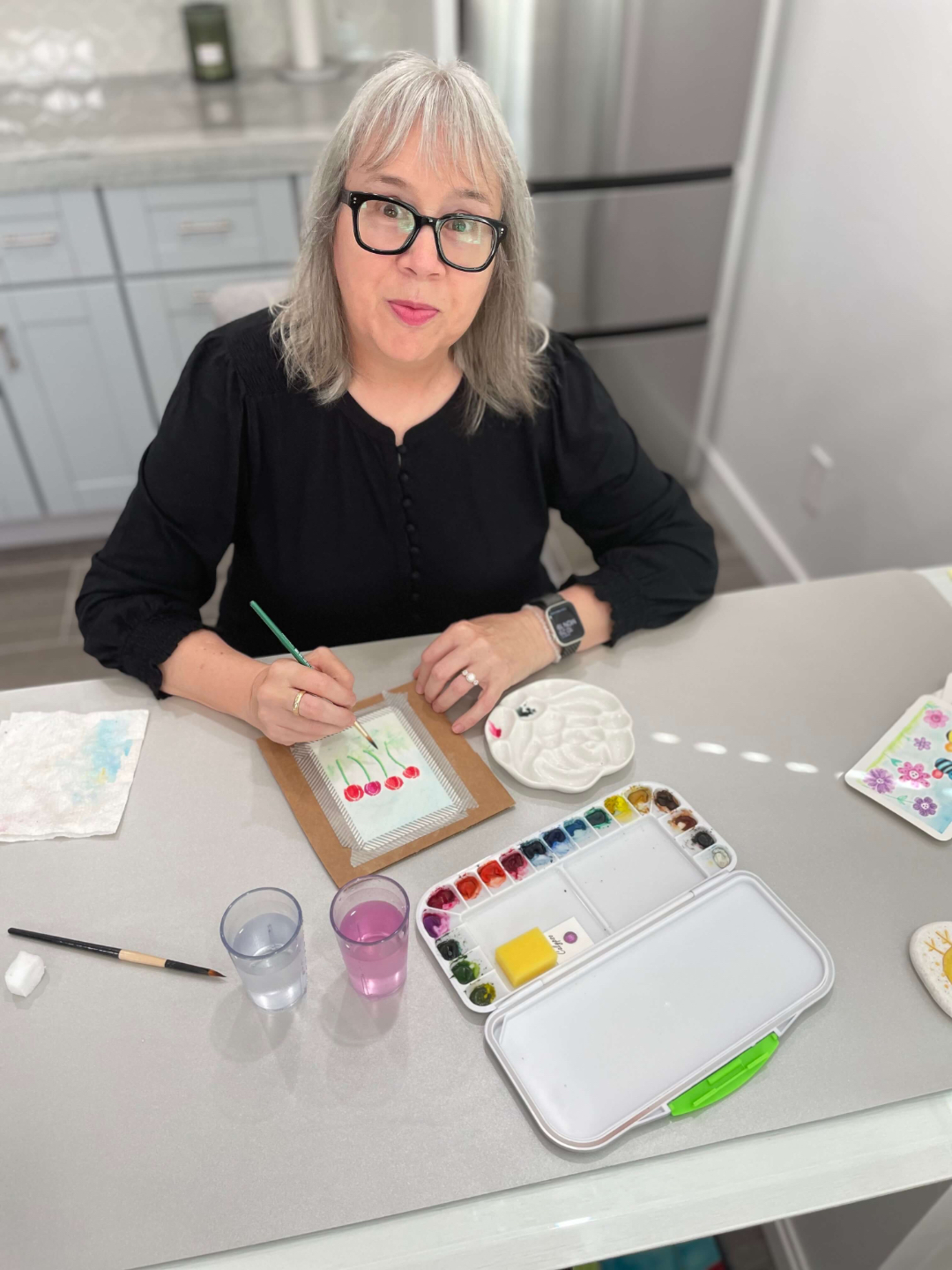 An image of artist/educator Mary Moreno at her studio table.