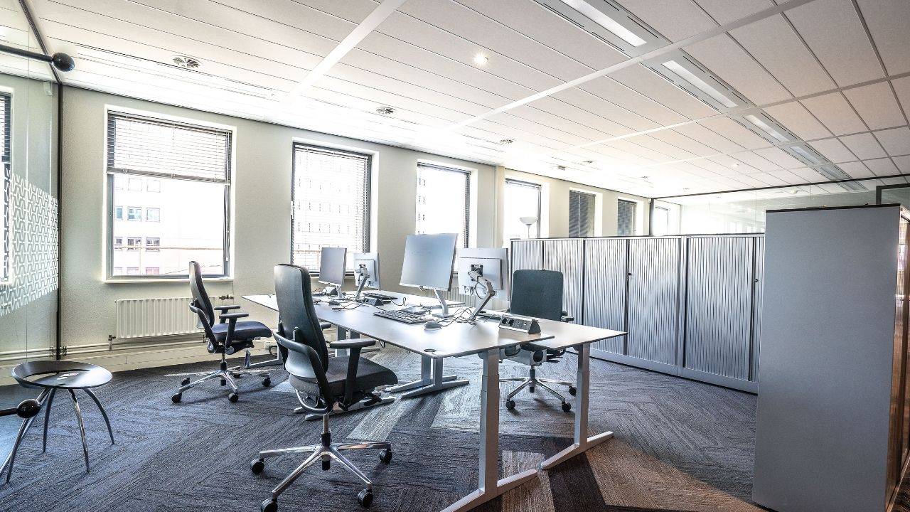 Modern office workspace representing AI-driven job redesign and changing workplace expectations