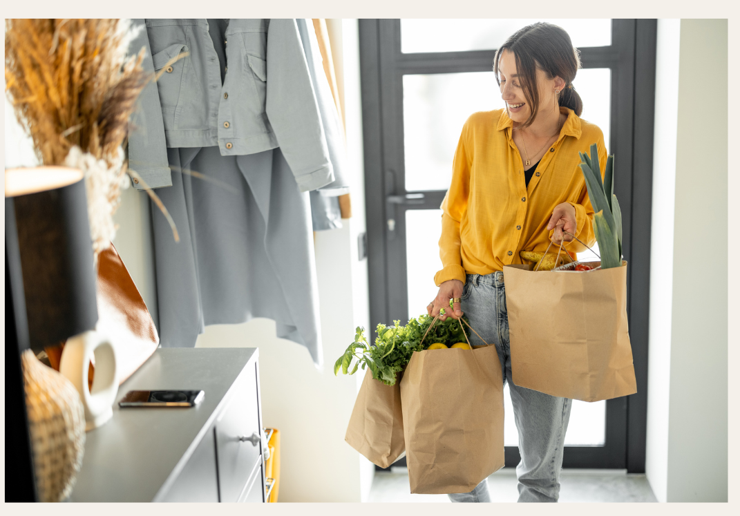 A woman carrying grocery bags