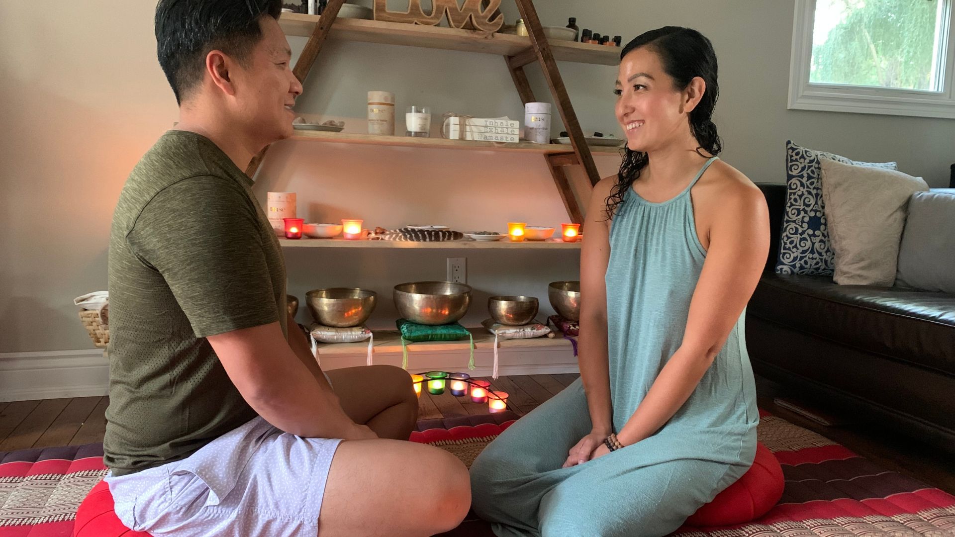 Holistic Intimacy Coach Training - couple sitting cross legged 