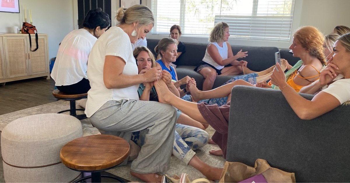 Amber teaching a small living-room class