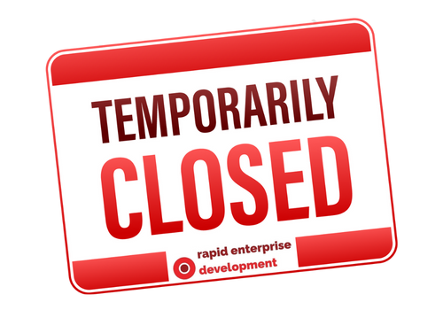 Bold red sign reads 'TEMPORARILY CLOSED' with 'rapid enterprise development' in smaller text below.