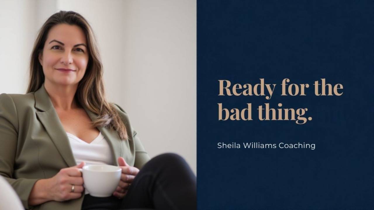 Sheila Williams with a serious expression sitting with a tea cup in her hand